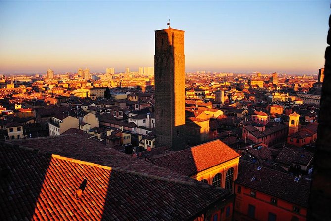 Bologna By Night Walking Tour - Stop 2: Piazza Santo Stefano lit up for evening color