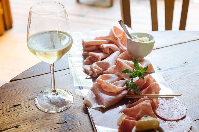 Bologna By Night Walking Tour - Quadrilatero tasting time: wine, cold cuts, and one main food moment